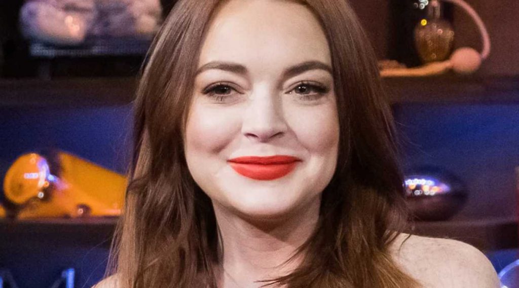Lindsay Lohan celebrates her red carpet comeback in an extremely elegant naked dress with XXL flowers